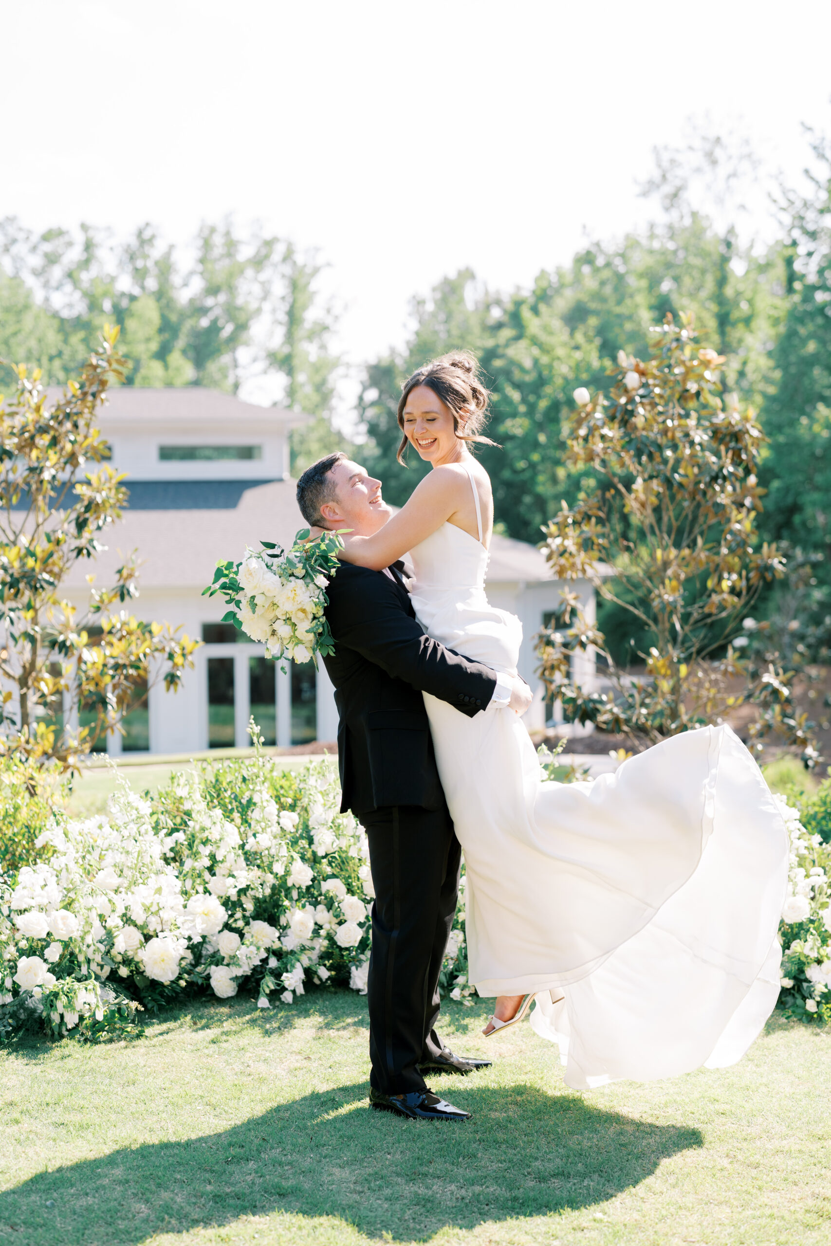 Newlyweds at The Upchurch in Cary, NC after their wedding ceremony, planned and designed by Vow and Verve.